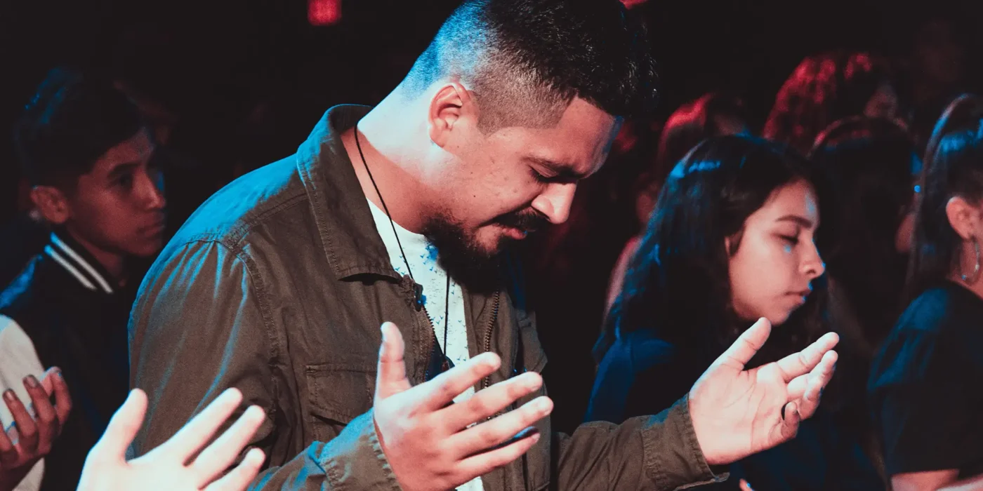 People praying in a church service