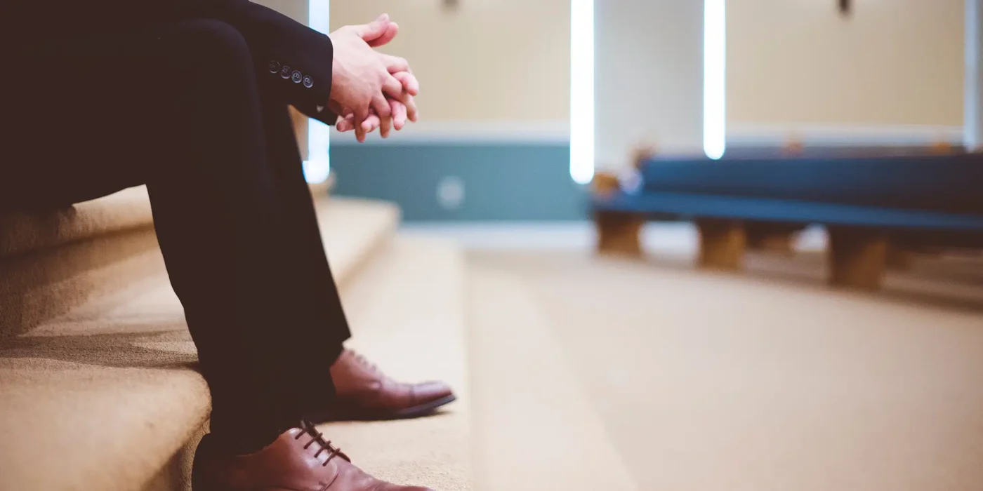 Man sitting in the auditorium of a church